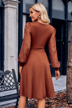 Load image into Gallery viewer, Gabrielle Surplice Neck Swiss Dot Long Sleeve Dress